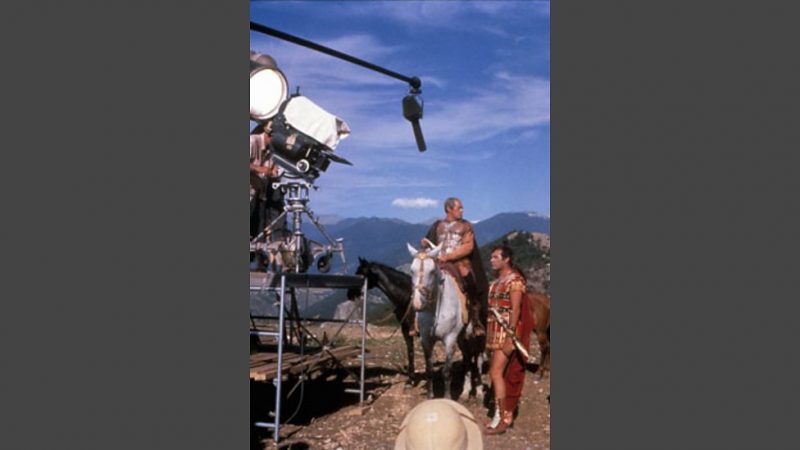 Richard Burton riding on set