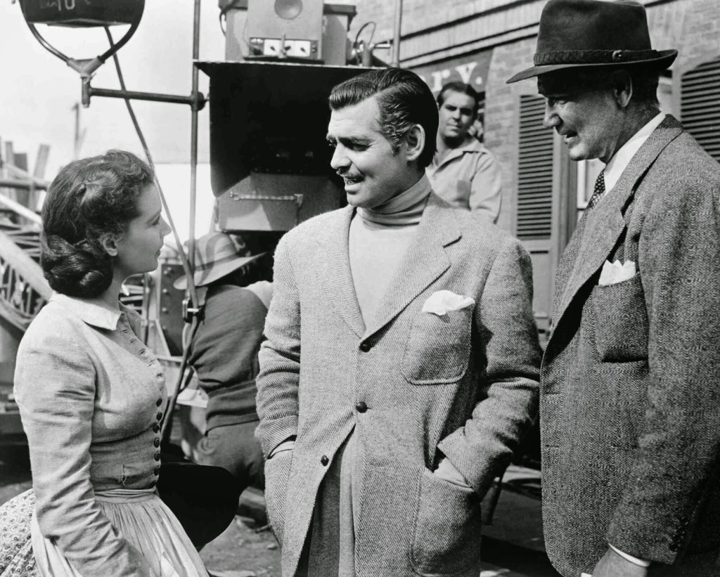 Vivien Leigh as Scarlett O'Hara, Clark Gable who plays Rhett Butler, and director Victor Fleming, on the Atlanta evacuation set.