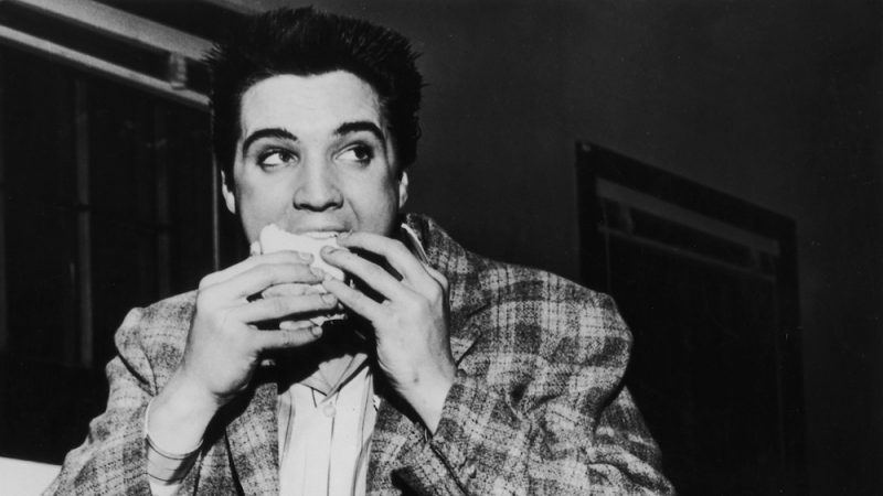 Elvis eating a sandwich