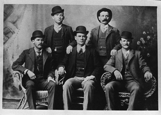The famous photograph of the Wild Bunch taken in Fort Worth in 1901, with Sundance in the left front and Butch in the right front. Harvey Logan is standing on the right. Photo credit: hegreatwesternmovies.com