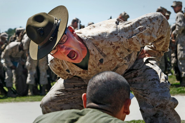 Sgt. Justin Glenn Burnside motivates a recruit with Echo Company, 2nd Recruit Training Battalion at Marine Corps Recruit Depot Parris Island. Photo by Lance Cpl. David Bessey. source 
