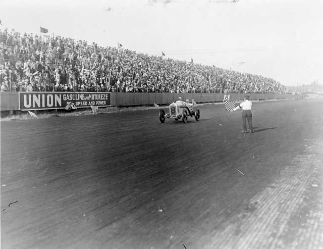 Earl Cooper approaches the checkered flag in his Stutz racing car at the Tacoma Speedway, July 4, 1915