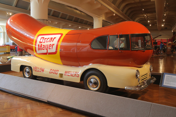  Shaped like a hot dog on a bun, "Wienermobile" is the name for a series of automobiles which were used to promote and advertise Oscar Mayer products in the United States. One of these models is on display at the Henry Ford Museum in Dearborn, Michigan. source