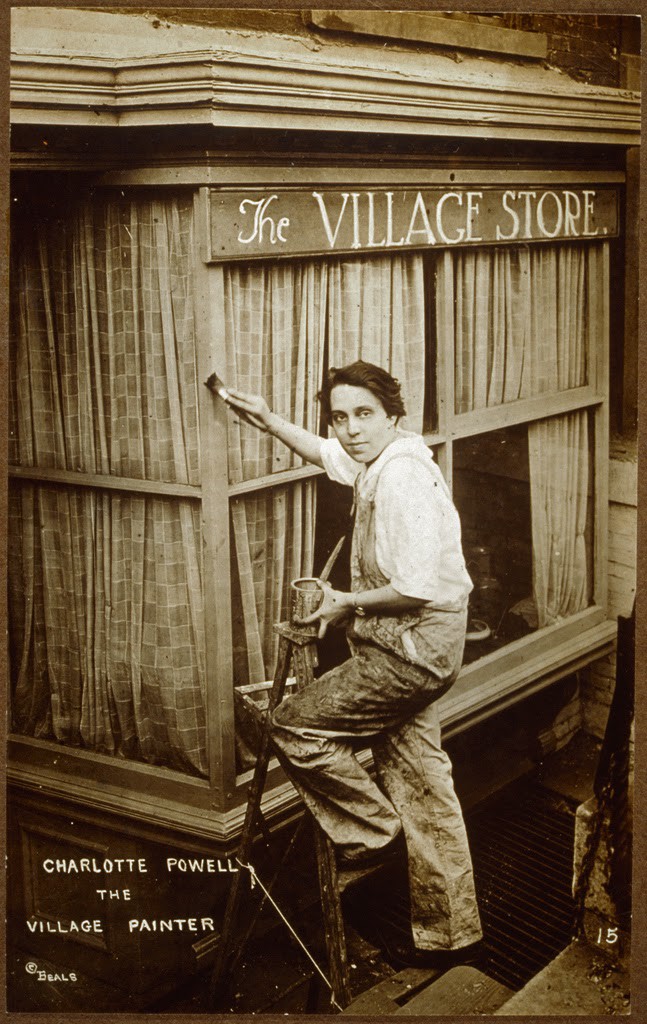 Portrait of Charlotte Powell standing on a ladder and painting the exterior of The Village Store, Sheridan Square, ca. 1915-1926. Photo credit: Schlesinger Library on the History of Women in America