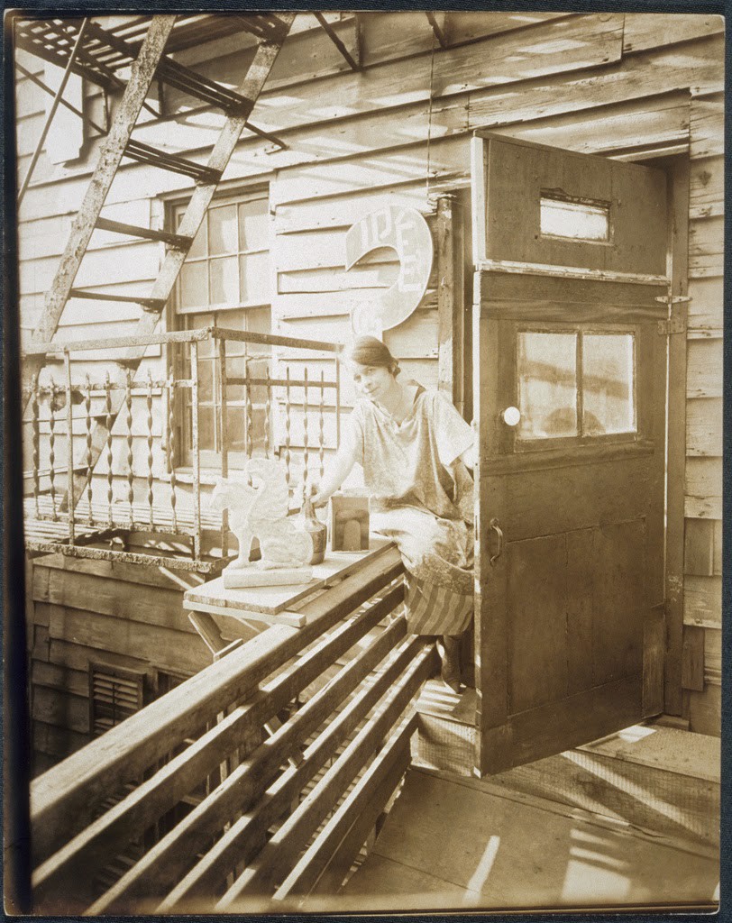 Portrait of an unidentified woman seated on a porch rail, ca. 1918-1920. Photo credit: Schlesinger Library on the History of Women in America