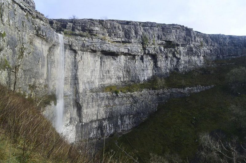 Water falls over the cliffs at Malham Cove, North Yorkshire, for the first time in a hundred years following heavy rain in the area. source