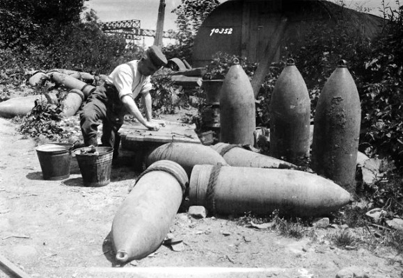 Between Laon and Soissons, German railway troops wash their clothes beside 50 cm shells, on July 19, 1918. (National Archive/Official German Photograph of WWI)