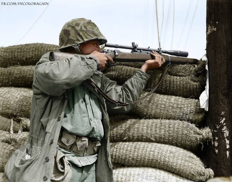 A US Marine marksmen with a Springfield M1903AI/Unertl Sniper rifle watches from behind a barricade for a North Korean sniper to show himself in Seoul, on September 28, 1950. #USMarines (Colorized by Noah Werner Winslow from the USA) https://www.facebook.com/incoloragain