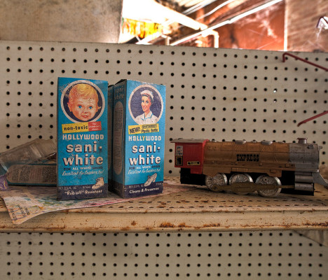 Shelves of old toys and cleaners