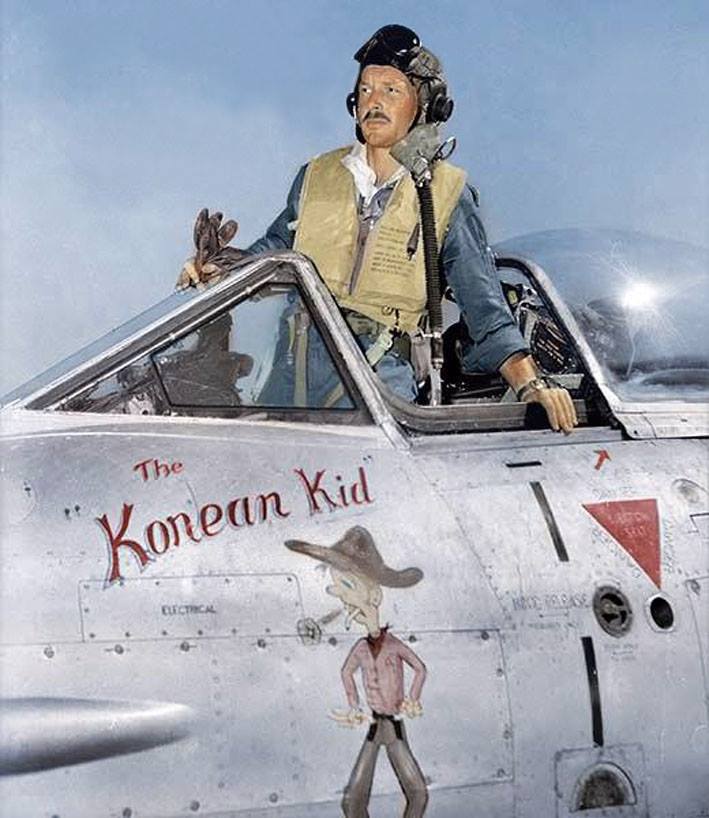  Australian Pilot Officer Randall (Randy) Green, a former member of No. 23 (City of Brisbane) Squadron RAAF prepares for a mission against targets in North Korea with No 77 Squadron RAAF. The nose art on his aircraft reads "the Korean Kid'.  This Meteor, A77-316, was normally flown by Sergeant James C Kichenside, who served in Kimpo, Korea, from March until September 1952, completing 148 operational missions.  Sgt Kichenside was the youngest pilot in the squadron and was known as 'the Korean Kid'. The ground crew of 77 Squadron decided to organise the painting of the logo on A77-316, after which a brief handing-over ceremony was held to 'present' the aircraft to Sgt Kichenside. It was standard practice that after a period of consolidation, and, whenever practical, a pilot could sign for and fly the same aircraft consistently.  He flew many missions in this aircraft until its last flight on 27 August 1952, when a mix-up meant he flew A77-258.  Aircraft A77-316 was piloted by Flying Officer Oelof M. Bergh RAF, an officer flying with 77 Squadron as part of an RAF exchange program to bolster the depleted numbers of operationally trained pilots. On this occasion the aircraft A77-316 was hit by ground fire, F/O Bergh ejected safely but spent the remainder of the conflict as a prisoner of war. "Stories of Oelof are legion. He was one of the few RAF pilots who was chosen to fly in the Commonwealth Squadron in Korea.  He spent 18 months in the hands of the North Koreans who tried to break him. He spent most of his time up to his neck in freezing water in a pit. Oelof would always make light of this, although I believe he never fully recovered from the experience. He said that the North Koreans unusually sent him back before the end of the war as they couldn't put up with the hard time he was giving them!" (Wing Commander Mick A F Ryan - Retd) Oelof M. Bergh died 15th May 1983, aged just 58 Randall Green died 16th September 2008 Squadron Leader James C. Kichenside, RAAF, whilst commanding the Antarctic Flight at Mawson Station in 1960, had a glacier named after him. (Source - Australian War Memorial collection JK0351) (Colorized by Tom Thounaojam from India) https://www.facebook.com/pages/Coloring-Past/631167093560788