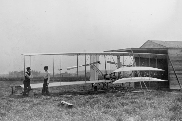 Wilbur and Orville Wright with their second powered machine on Huffman Prairie, near Dayton, Ohio, in May of 1904.