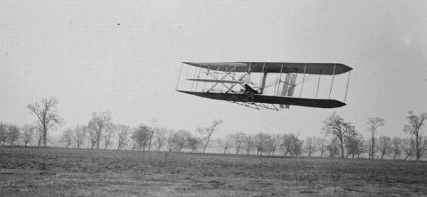 Orville in flight over Huffman Prairie in Wright Flyer II. Flight #85, approximately 1,760 feet (536 m) in 40 1⁄5 seconds, November 16, 1904.