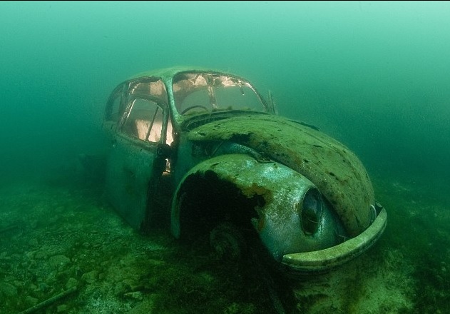 The shell of a VW beetle that was purposely sunk in Capernwray Quarry in Lancashire as an attraction to divers. Photo credit Alexander Mustard 