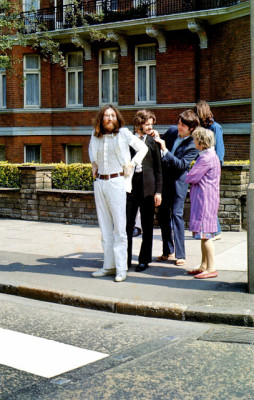 The Beatles waiting to cross Abbey Road. source