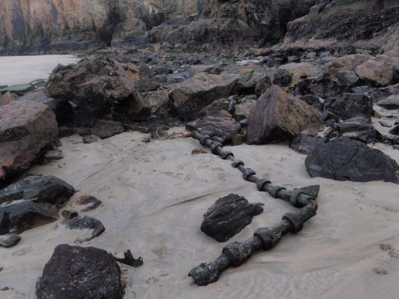 With the sand level temporarily dropped, remains of the old transatlantic telephone cable system have been exposed below Droskyn point, Perranporth, Cornwall. Photo taken 9th February 2012. source