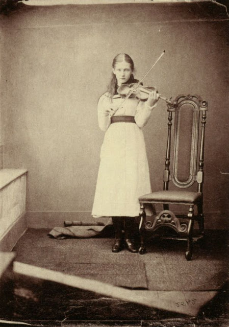 A young girl playing violin, Oxford, July 17, 1878