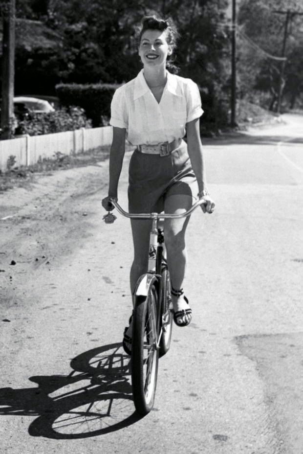 Ava Gardner rides a bike, 1952