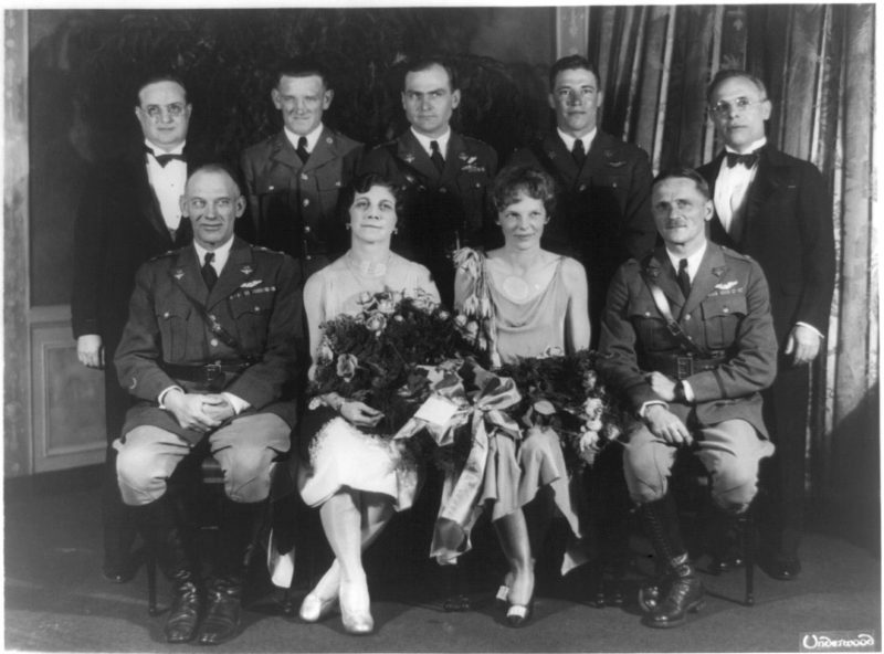 Carl Spaatz and Amelia Earhart posed with seven other people, between ca. 1928 and 1937