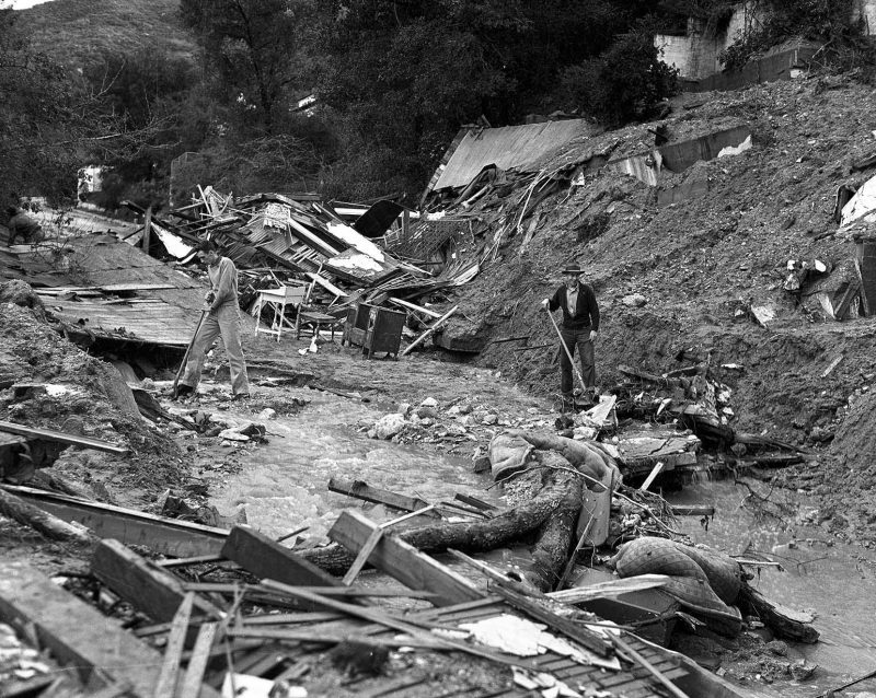 March 3, 1938 These ruins were once a residence on the 2000 block of Los Encinos Street, Glendale. Two men met their death when the house collapsed into the street. Workmen search for the bodies.
