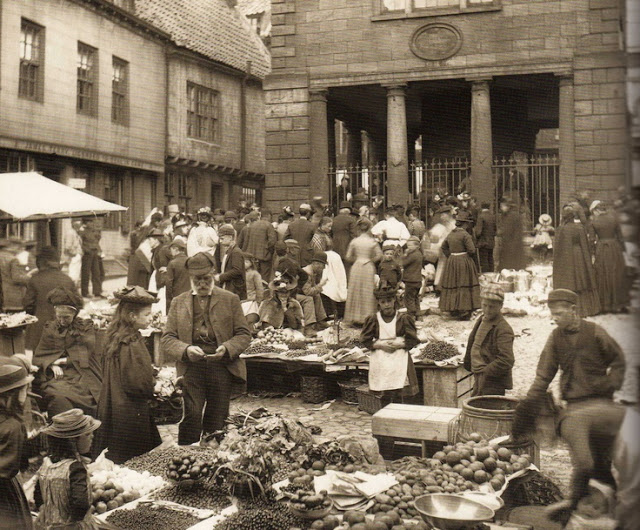 Market place in Whitby with the Town Hall in the background, ca. 1900