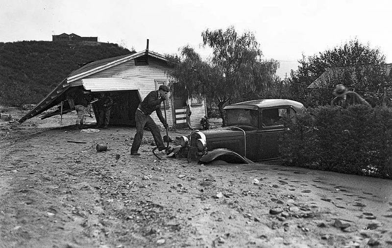 Oct. 18, 1934: Workers dig out car and remains of home on Glenada Ave. in Montrose following flooding from a storm the night before.