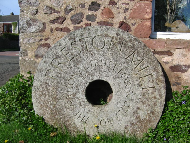 Ornamental millstone with legend Preston Mill National Trust for Scotland