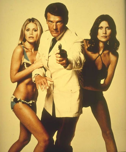Roger Moore with Britt Ekland, left, as Mary Goodnight, with Maud Adams, right, as Andrea Anders in The Man with the Golden Gun