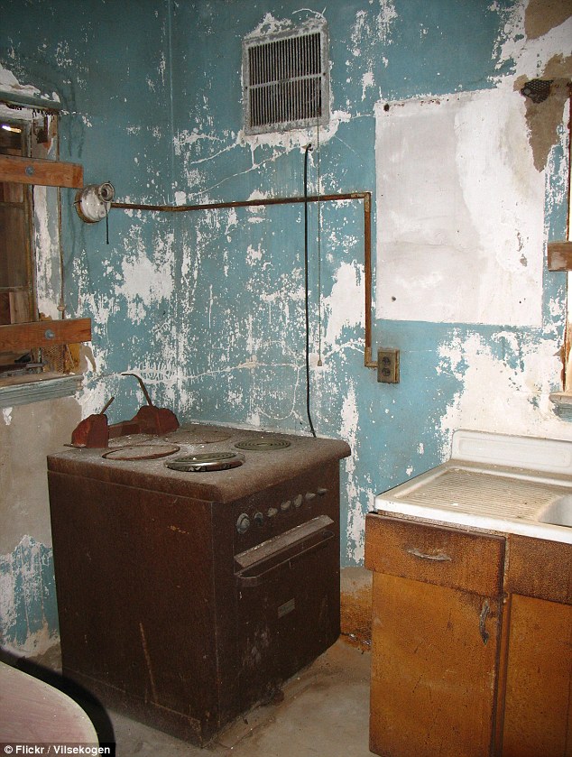 An old stove and furniture are among the items left inside the hospital after it closed in 1954 