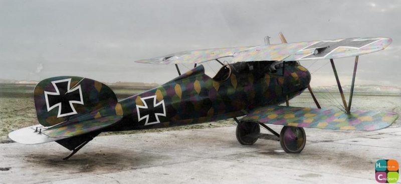 Albatros D.V prototype with 'lozenge' camouflage. April 1917. Toward the end of 1916, Germany introduced a new scheme called 'Lozenge' camouflage which was made up of polygons in four or five colors, sometimes more, printed on the fabric. This camouflage not only saved the weight of the paint, but also the time needed to apply it to each and every aircraft. Germany also had to develop camoflage schemes involving patterns that disrupted the silhouette of the plane making it difficult to distinguish the silhouette of the aircraft; the three to five colors they used were often quite similar to the ones printed on the “lozenge fabric”. (wwiaviation.com) The Albatros D.V was a fighter aircraft used by the Luftstreitkräfte (Imperial German Air Service) during World War I. The D.V was the final development of the Albatros D.I family, and the last Albatros fighter to see operational service. Despite its well-known shortcomings and general obsolescence, approximately 900 D.V and 1,612 D.Va aircraft were built before production halted in early 1918. The D.Va continued in operational service until the end of the war. In April 1917, Albatros received an order from the Idflieg (Inspektion der Fliegertruppen) for an improved version of the D.III. The prototype flew later that month. The resulting D.V closely resembled the D.III and used the same 127 kW (170 hp) Mercedes D.IIIa engine. The most notable difference was a new fuselage which was 32 kg (70 lb) lighter than that of the D.III. The elliptical cross-section required an additional longeron on each side of the fuselage. The prototype D.V retained the standard rudder of the Johannisthal-built D.III, but production examples used the enlarged rudder featured on D.IIIs built by Ostdeutsche Albatros Werke (OAW). The D.V also featured a larger spinner and ventral fin. (skytamer.com) (Colorised by Frédéric Duriez from France) https://www.facebook.com/pages/Histoire-de-Couleurs/695886770496139