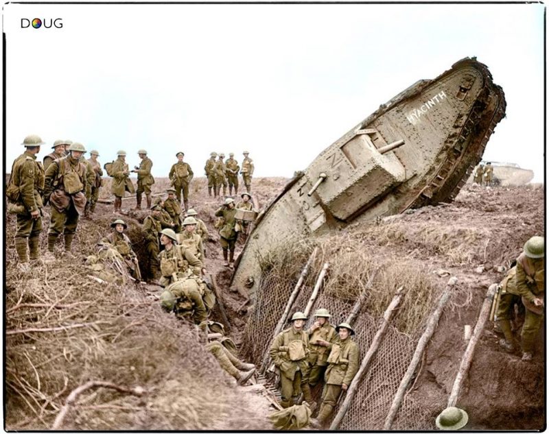 A Mark IV (Male) tank H45 'Hyacinth' of H Battalion ditched in a German trench while supporting the 1st Battalion, Leicestershire Regiment, one mile west of Ribecourt. Some men of the battalion are resting in the trench, 20 November 1917. Commanded by 2nd Lt. Jackson, H Btn, 24 Coy, 10 Sec. During the attack it reached the first objective of the day, The Hindenburg Line, before falling in the ditch. (additional info from John Winner) (Photo source - © IWM Q 6433) Photographer - Lt. John Warwick Brooke (Colourised by Doug)