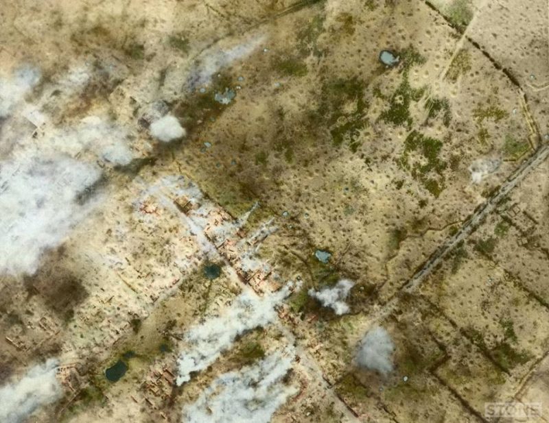 This is an aerial photograph of Messines, just to the South East of Ypres, this was taken on the 2nd of June 1917, just prior to the Mining attack, but presumably during the bombardment judging by the plumes of smoke. (Colourised by Nick Stone from the UK) http://www.invisibleworks.co.uk/ Colourist Nick Stone, "You start to doubt your sanity slightly when you spend an hour colouring in a photo brown that was, erm, brown, well sepia, but I’ve also tried to pull the detail out a bit as well." ".....you can see the scale of it, I realised as I worked on it you can see planks and joists as well as piles of brick rubble in quite a lot of detail, it becomes almost like a video game image, like some morsel of video intrigue from the 1990s, 'Close Combat', with it’s crawling terrified and tired men. There I suspect is one of the main problems we have in industrialised warfare, that game image and the fact that there’s real people in it down there somewhere too small to see while you’re pouring shells onto them or bombing them or now of course using missiles and drones. 