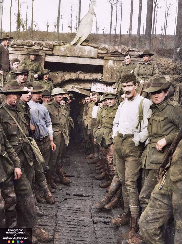 A group of Australian 7th Field Company Engineers at the 'Plumer Road' entrance to 'Wallangara', or the Catacombs as it was generally called, a system of tunnels built in Hill 63, Messines Ploegsteert Wood, 22nd January 1918. The soldier on the right in the white shirt has been identified as Driver - Alexander Henderson Priest (17822) from Collingwood, Victoria (demobbed in 1919 in good health) (Photo source - Official Photo no.E4487) Tasmanian Archives and Heritage Office: W.L. Crowther Library (Colorised by Frédéric Duriez from France) https://www.facebook.com/pages/Histoire-de-Couleurs/695886770496139