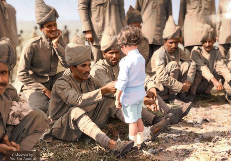 A French boy introduces himself to Indian soldiers who had just arrived in France to fight alongside French and British forces, Marseilles, 30th September 1914. "On 5 September 1914 General Willcocks took command of the first divisions of Indian Army troops, on 26 September, just seven weeks after the declaration of war, two brigades of the 3rd Lahore Division landed at Marseilles, France. This was notwithstanding the delays caused by the activities of the German raiders Emden and Konigsburg and the slow transport ships. The Sihind brigade had been dropped off in Egypt to reinforce the garrison there and did not make it to the front until November 1914." "The Army of India was little understood by the general public and many thought that Indian brigades and divisions were composed of Sikhs and Gurkhas alone, without including the many other races of India. Nor were they aware that in each brigade was a British battalion." "The Army of India in 1914 was trained for frontier war or minor overseas expeditions, and for these purposes was to a certain extent sufficiently well armed and equipped, but it was by no means fully so. The two divisions which sailed from Karachi and Bombay had to have their equipment completed at Marseilles, at Orleans, and on the battle front itself. The artillery was only made up by denuding the guns of other divisions and the rifles could not fire the latest class of ammunition with which the British Army was supplied. As a result both rifles and ammunition had to be handed into store at Marseilles and fresh arms issued making things difficult for the troops as most soldiers trained and practised with this weapon to the exclusion of almost all others." "Under the Indian officers were the N.C.O.’s all of whom were in charge of a vast array of people from different backgrounds including: Rajputs, Jats, Pashtuns, Sikhs, Gurkhas, Punjabis, sappers from Chennai (Madras State), Dogras, Garhwalis and many others." (read more; http://arc.parracity.nsw.gov.au/blog/2014/09/26/world-war-one-the-arrival-of-the-indian-army-in-france-1914-part-1/) (Colorized by Marina Amaral from Brazil) https://www.facebook.com/marinamaralarts/?fref=nf