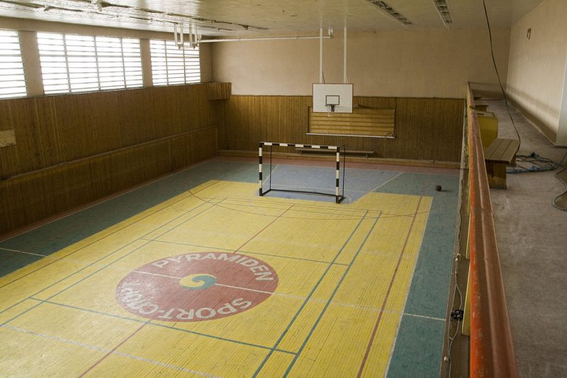 Inside the sports hall, one of the well-preserved buildings that tourists can visit. Wikipedia
