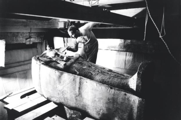 The archaeologist Howard Carter examines Tutankhamun’s coffin. Carter lamented how little we know about the boy-king’s life and death, but modern investigative techniques are slowly shining a light into the gloom. © Griffith institute/University of Oxford