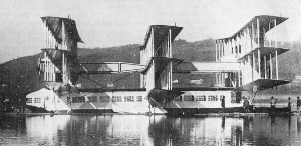 The Caproni Ca.60 on Lake Maggiore. This picture, taken in 1921, shows the three wing sets mounted on top of the hull and the booms that connected them, as well as the panoramic cabin windows. source