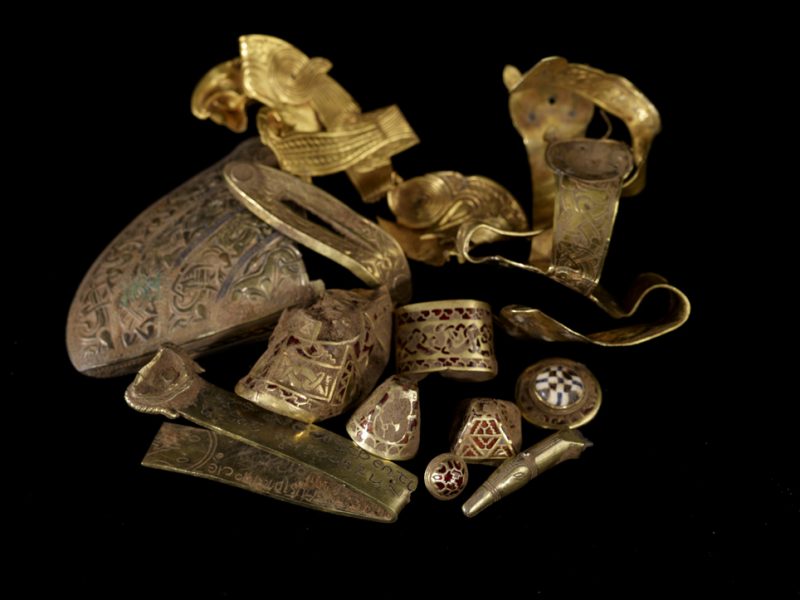 A selection of highlight pieces from the Staffordshire Hoard, uncleaned by conservators, still showing traces of soil. source