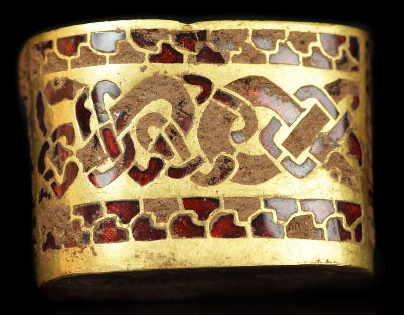 A gold sword hilt fitting with cloisonné garnet inlay. source