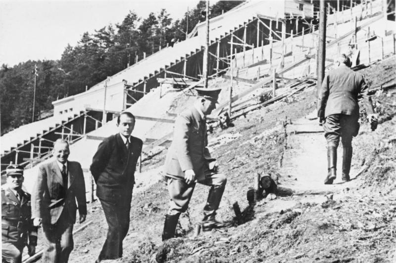 Adolf Hitler (Albert Speer, behind him) visiting a test construction site near Nuremberg.Source