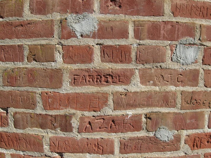 Damage caused by names being carved into bricks on Frenchman’s Tower. source