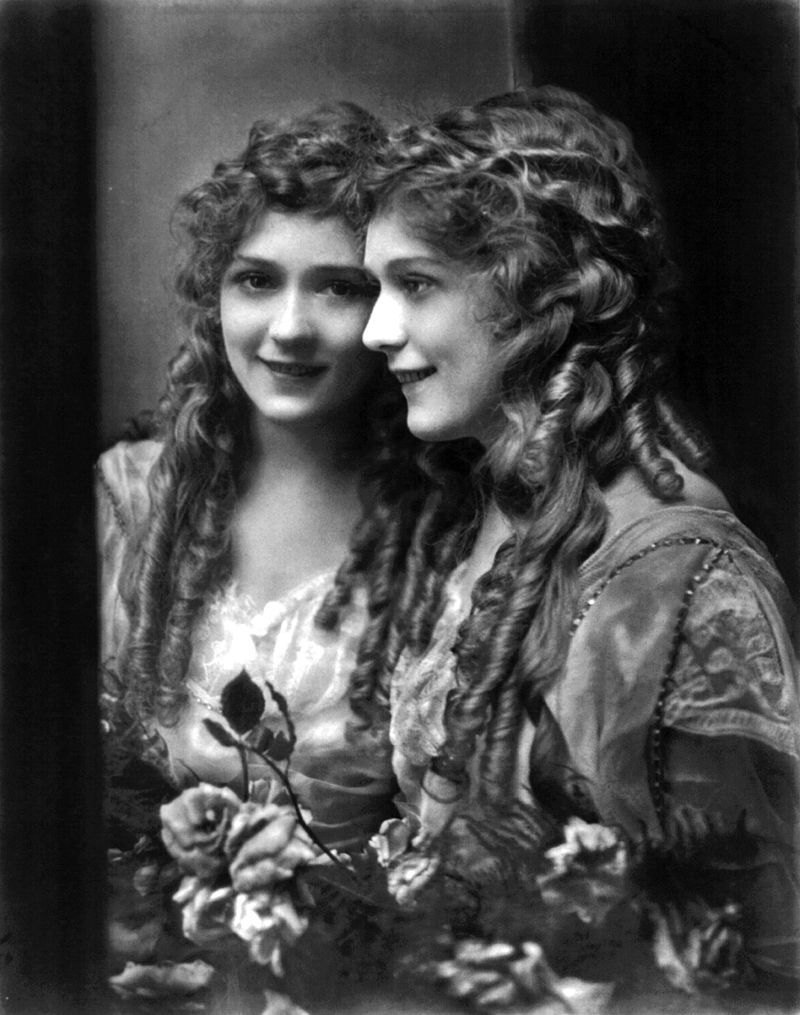 Mary Pickford, half-length, facing left, with mirror image, facing slightly left. .Source
