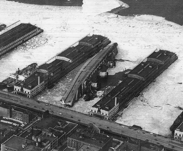 Normandie, renamed USS Lafayette, lies capsized in the frozen mud of her New York Pier the winter of 1942. source
