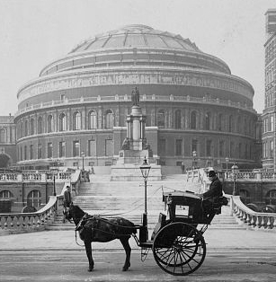 A hansom cab parked in front of the Royal Albert Hall, London, 1904. source