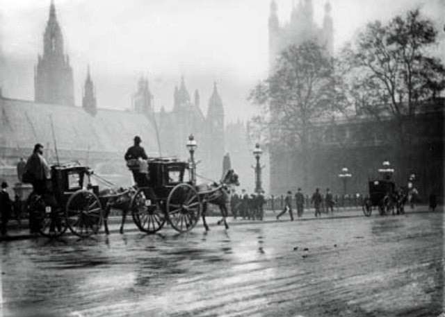 Hansom cabs and the four wheeled Growler on the west side of Parliament Square. source