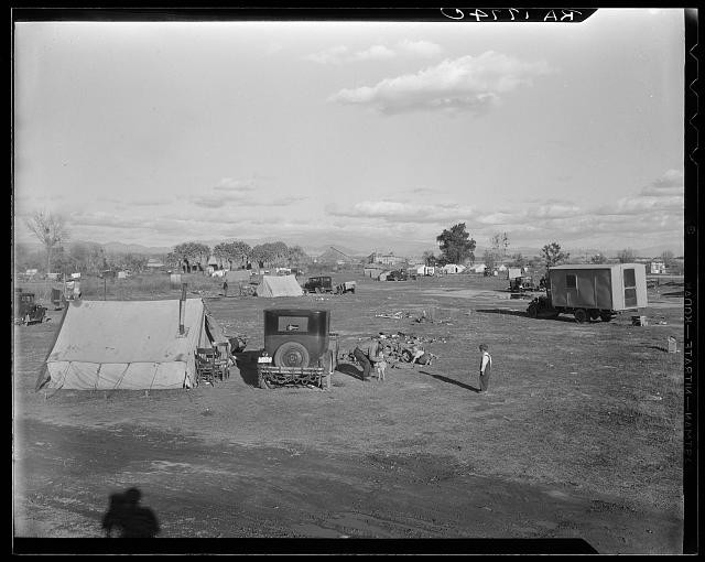 Hooverville of Bakersfield, California. A rapidly growing community of people living rent-free on the edge of the town dump in whatever kind of shelter available.
