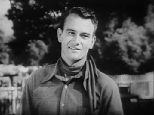 John Wayne as 'Singin' Sandy' Saunders in Riders of Destiny (1933).Source