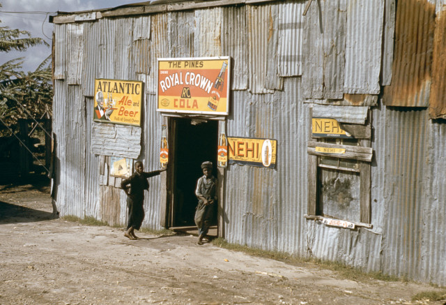 Migrant children stand outside a juke joint in Belle Glade, Florida.