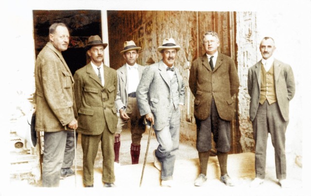 Standing outside tomb KV 6, of Ramesses IX, are members of the archaeological team including Harry Burton (third from left) and Howard Carter (fourth from left).