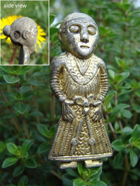 The small figurine of Freya. A newly discovered female figurine amulet from Revninge in the east of Denmark represents a very interesting find due to her remarkably detailed Viking Age dress. This small gilt silver figurine contains a wealth of detail giving new knowledge about costume and jewelry of the period.