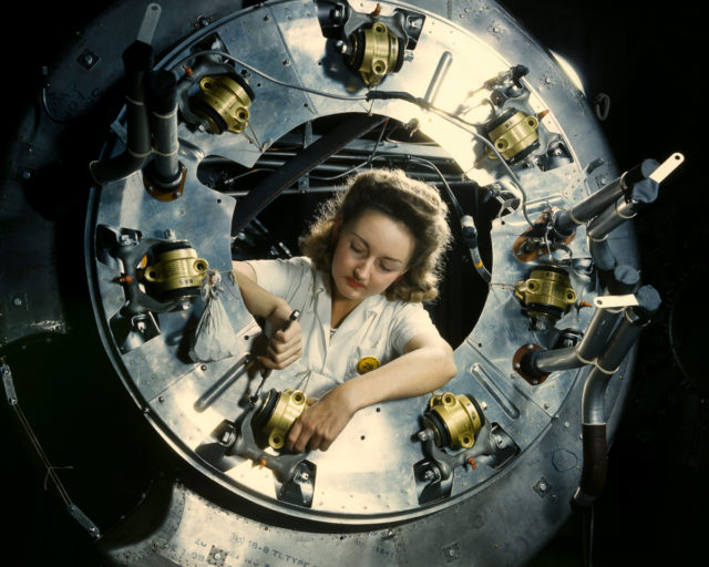 A worker assembles part of the cowling for a B-52 bomber motor at the North American Aviation plant in Inglewood, California.